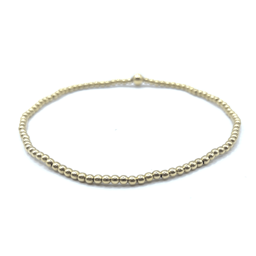 14k gold filled 2mm beaded stretch bracelet with single 4mm gold filled bead.  wear single or stack it.  part of our erin gray waterproof collection.  Available in 6.5" / 7.0"