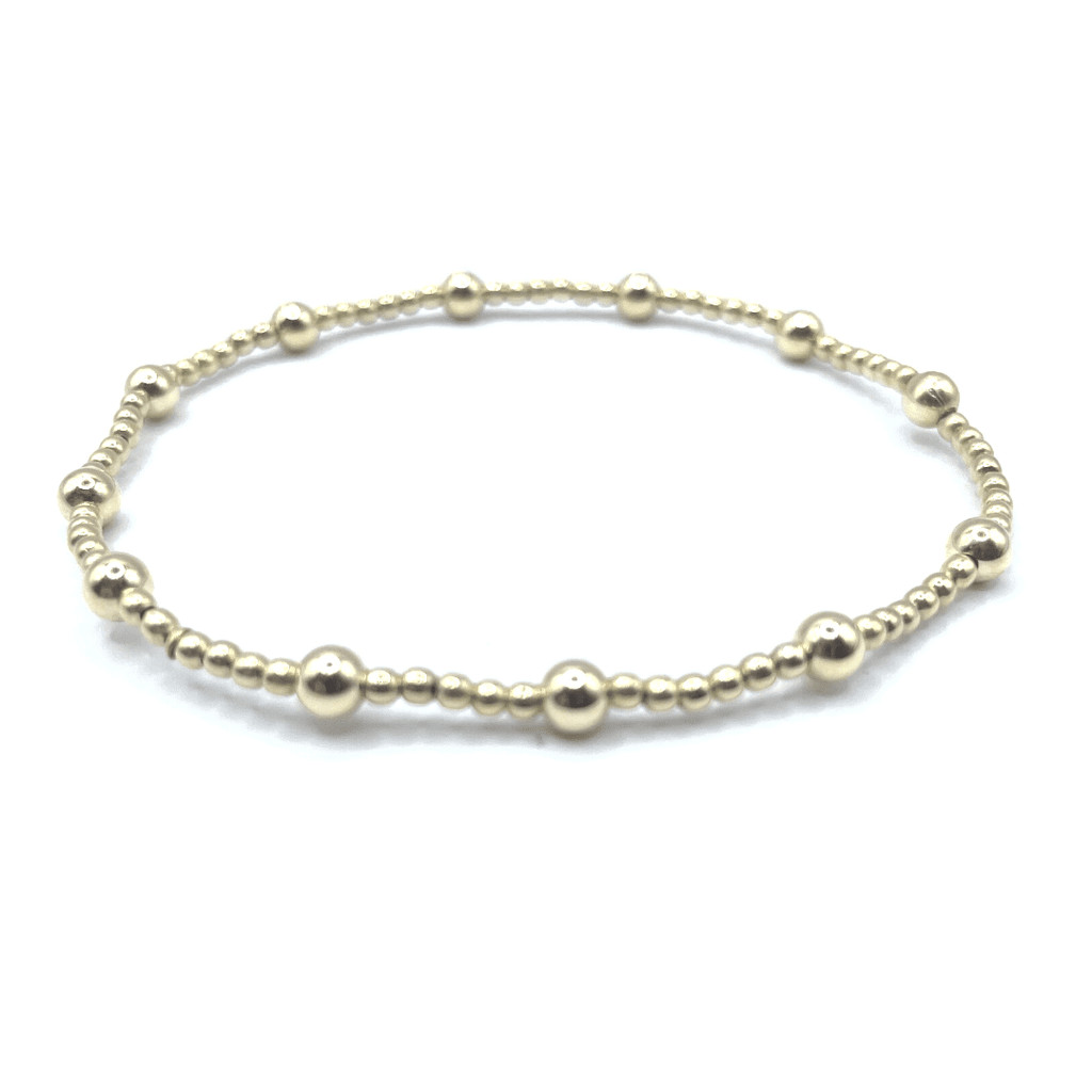 14k gold filled 2mm beaded stretch bracelet with twelve 4mm gold filled beads.  wear single or stack it.  part of our erin gray waterproof collection.  Available in 6.5" / 7.0" / 7.25"