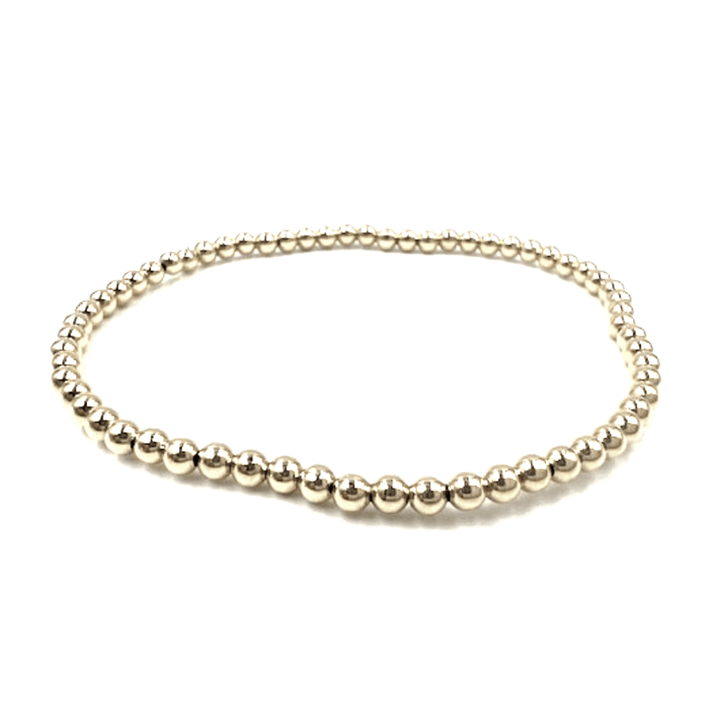 14k gold filled 3mm beaded stretch bracelet.  wear single or stack it.  part of our erin gray waterproof collection.  6.5"-7"-7.25" 