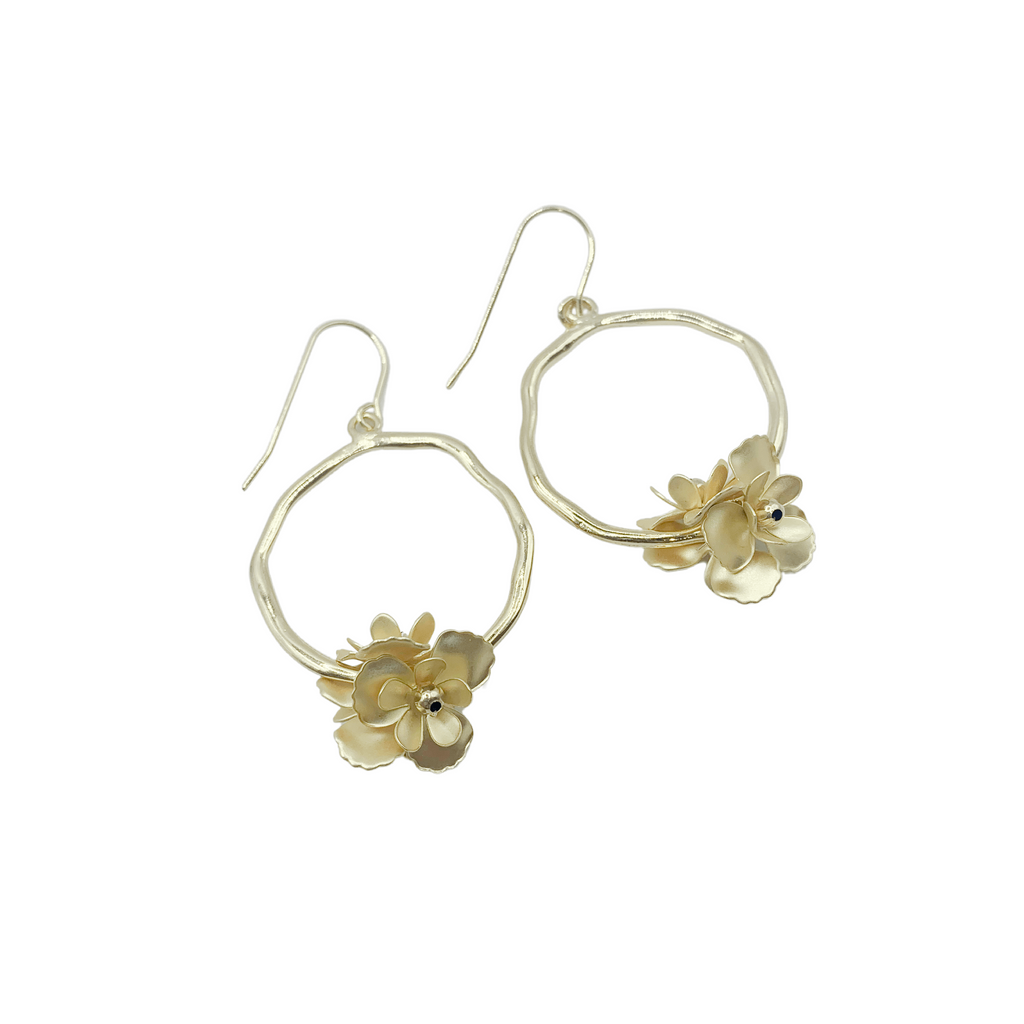 Style inspiration!  Organic gold hoop earrings with unique flower accents.