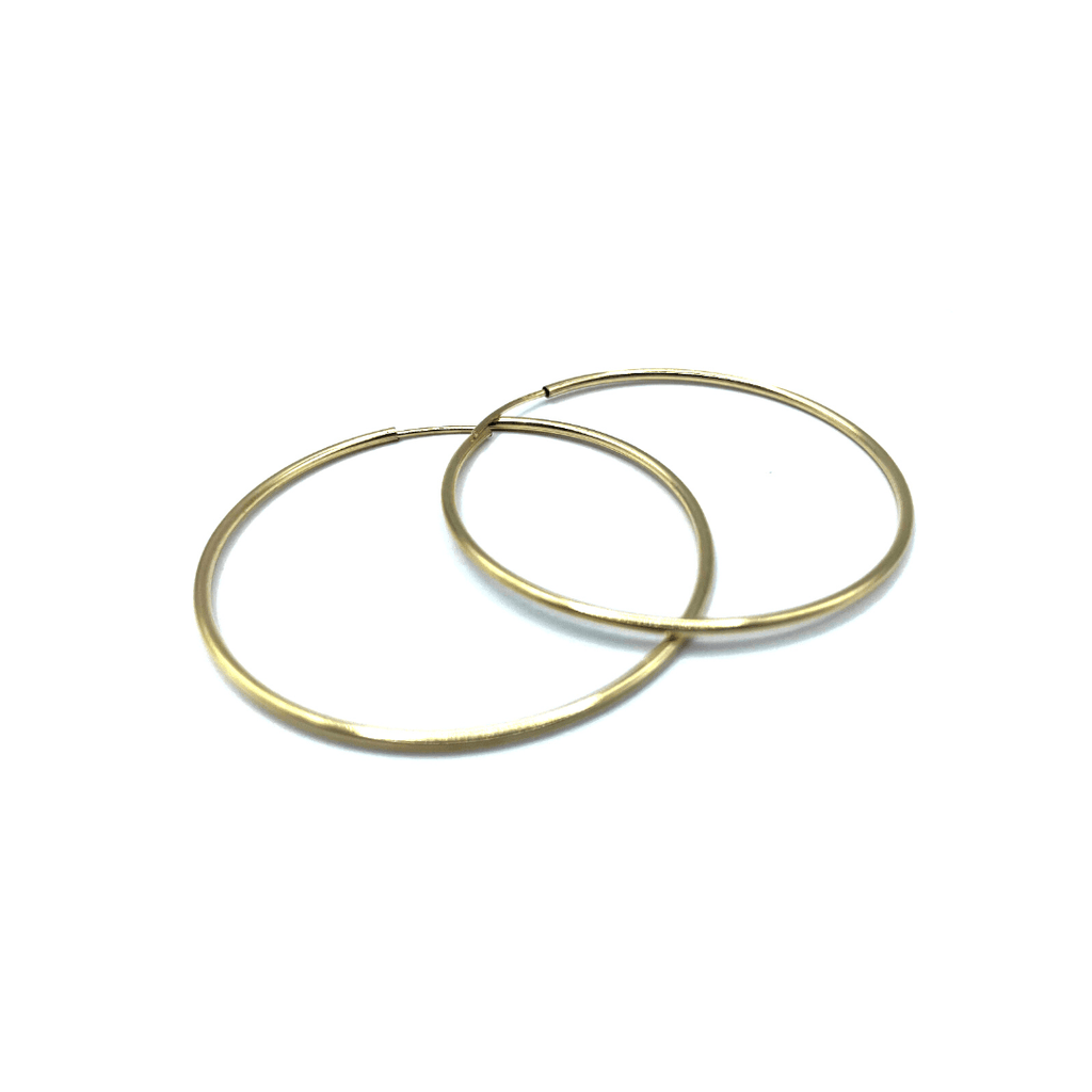 Our slender and sleek two inch endless 14k gold filled, 40mm hoop. A unique classic. 