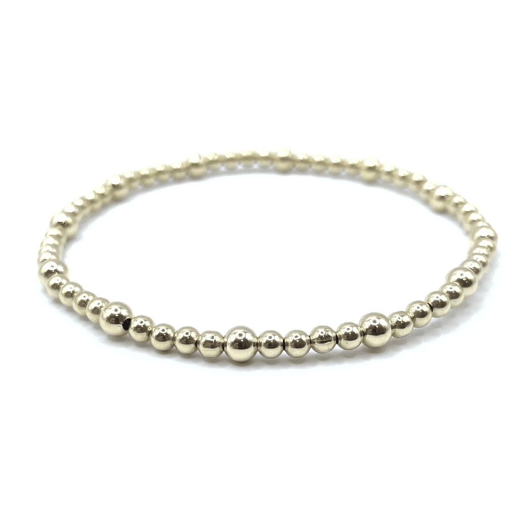 14k gold filled 3mm mixed with 4mm beaded stretch bracelet. Wear single or stack it. Part of our erin gray waterproof collection. Available in 6.5", 7" and 7.25" bracelets.