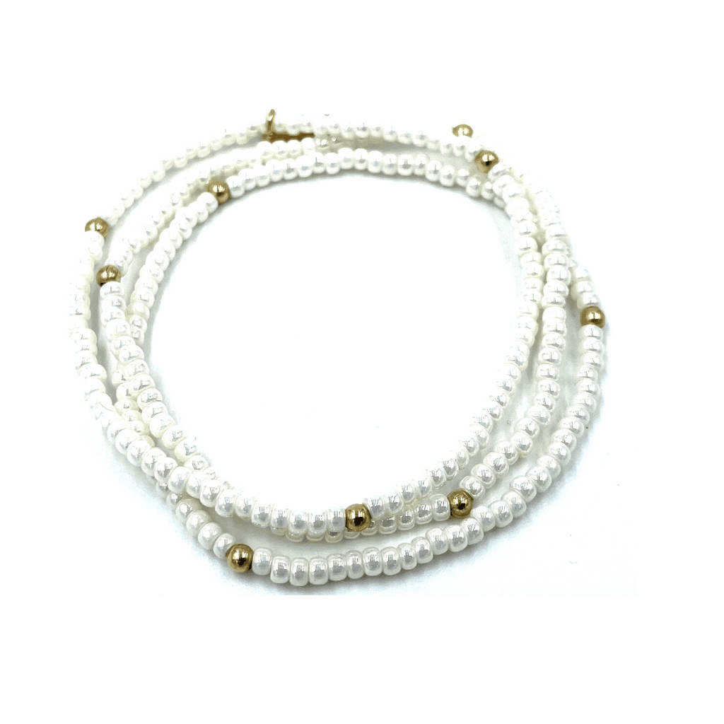 Our erin gray original (OG) classic 3-stack bracelets in pearl white dotted with 14k gold-filled 3mm beads. A classic favorite that stacks well with others. 7 inch stretch bracelets.