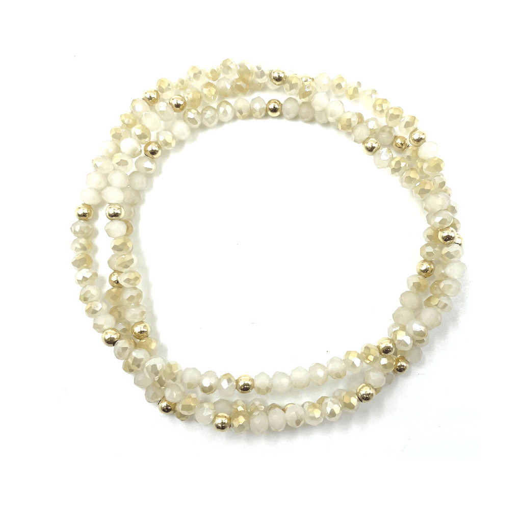 Our erin gray original (OG) classic shimmer 3-stack bracelets in winter white sparkle, dotted with 14k gold-filled 3mm beads. A classic favorite that stacks well with others. 7 inch stretch bracelets.