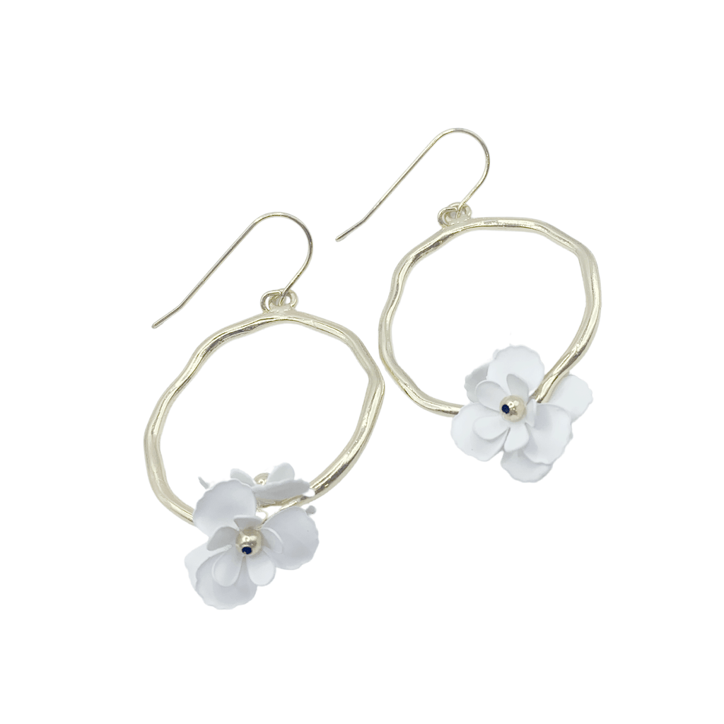 Style inspiration! Organic gold hoop earrings with unique flower accents.