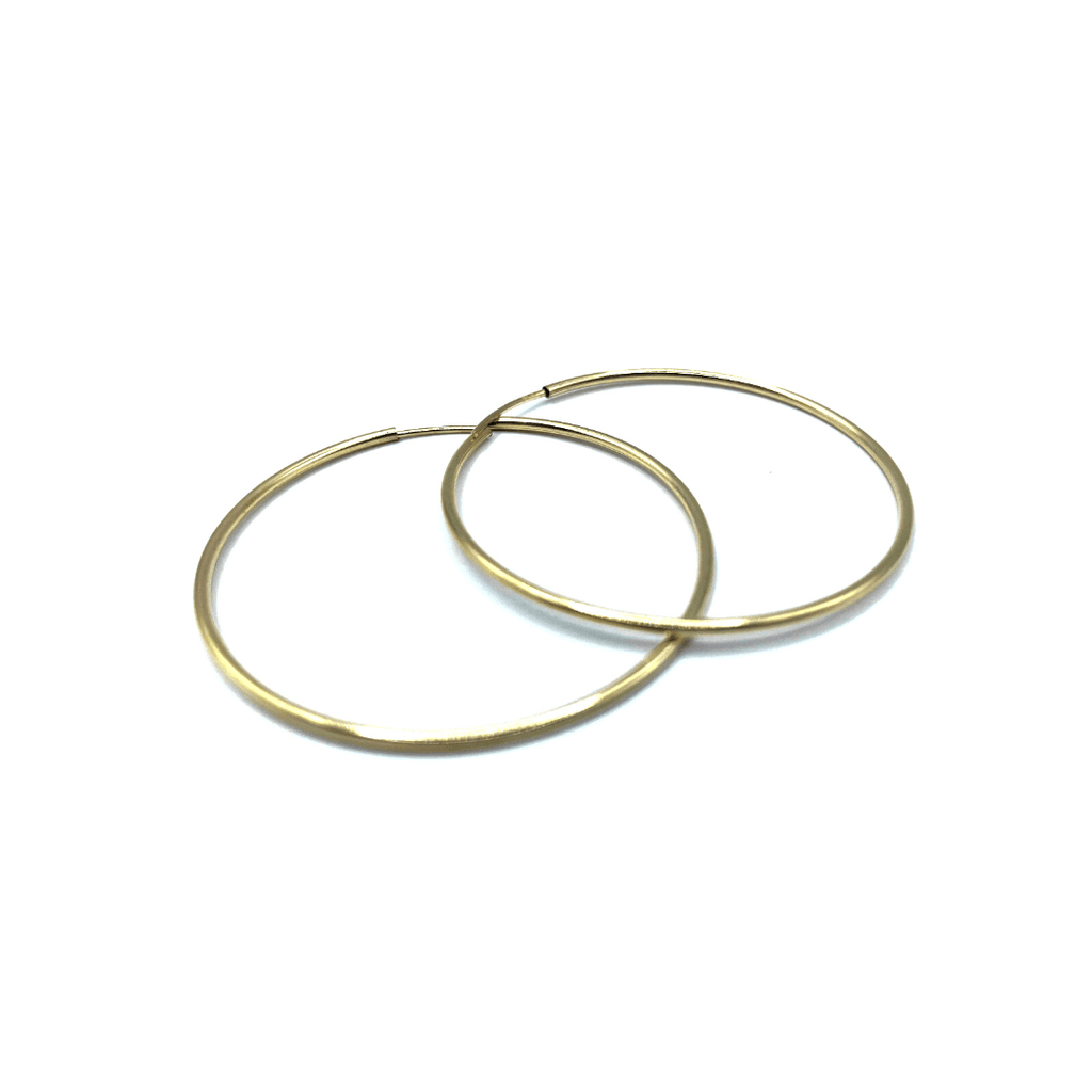 Our slender and sleek two inch endless 14k gold filled, 40mm hoop. A unique classic.